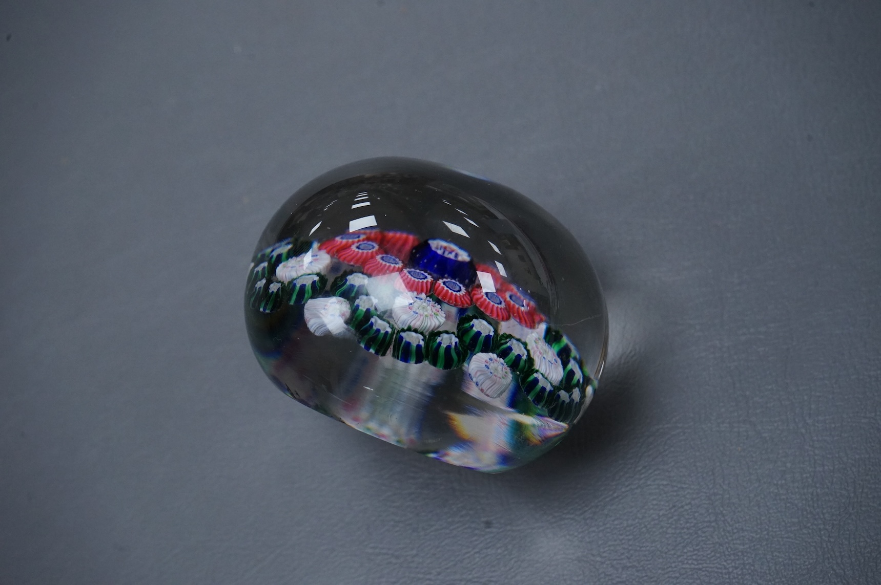 A Clichy glass garland paperweight, 7cm diameter.